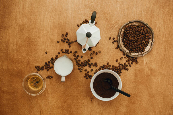 Flat lay of making coffee. Roasted coffee beans, grounded coffee - Photo, Image