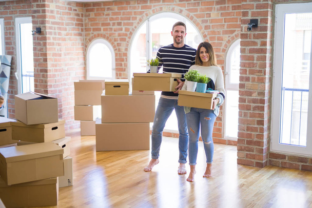 happy young couple moving to new flat - Photo, Image