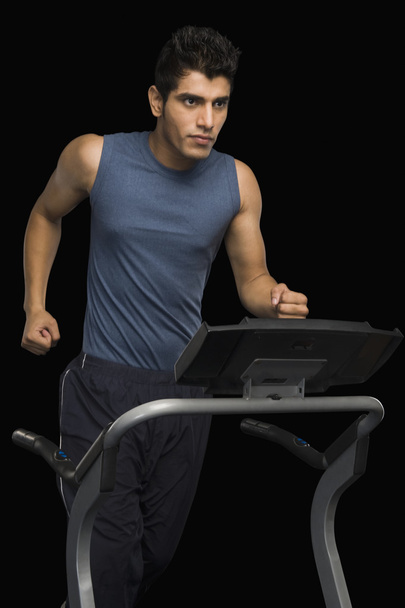 Man running on a treadmill - Fotó, kép