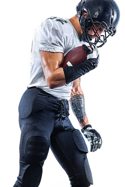 American football player. Sportsman with ball in helmet on stadium in action. Sport wallpaper. Team sports. - Fotoğraf, Görsel