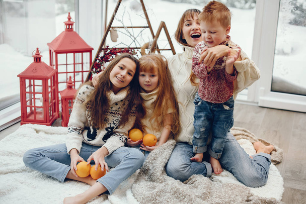 Family spending time at home in a christmas decorations - Foto, Bild