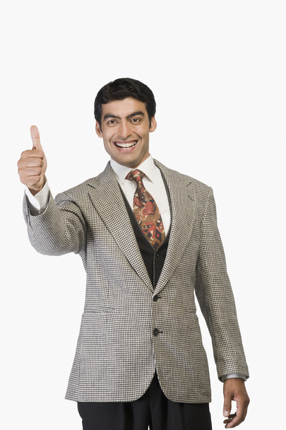 Businessman showing thumbs up - Фото, изображение
