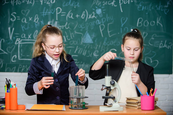 For a better tomorrow. Little girls genius in school lab. Science lab. science experiments in laboratory. Biology lab. Genius. Little girls scientist with microscope. Chemistry research in laboratory - Photo, image