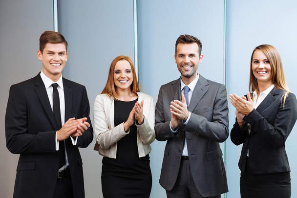 Happy business people clapping their hands - Фото, изображение