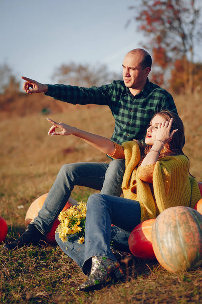 Beautiful couple spend time in a autumn park - Photo, Image