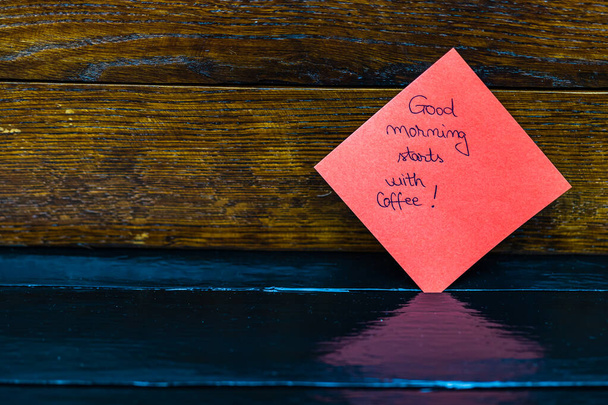 Text Good morning starts with a coffee on post it. Writing on st - Valokuva, kuva