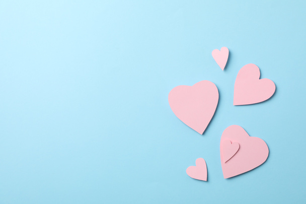 Decorative hearts on blue background, space for text - Photo, Image