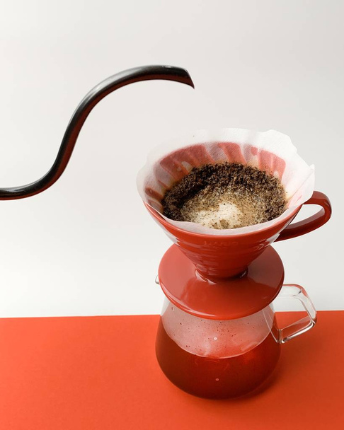 Purover coffee making proces on red white backgroun - 写真・画像