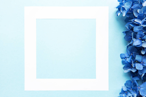 White frame and blue hydrangea flowers - Fotografie, Obrázek