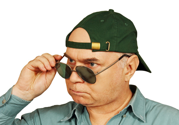 a man in a baseball cap and dark glasses. - Photo, Image