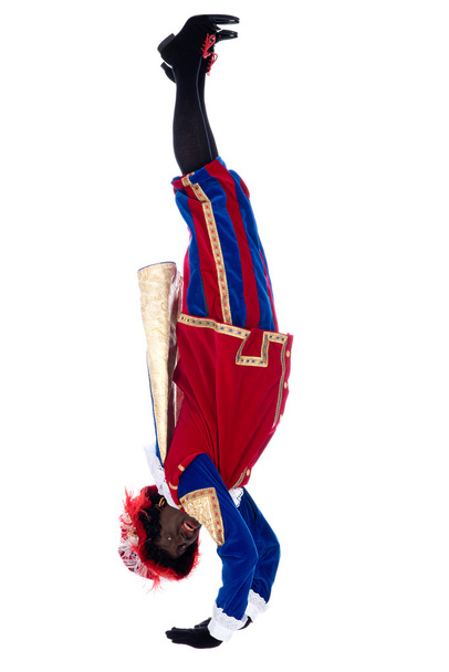 Zwarte Piet sta facendo una verticale
 - Foto, immagini