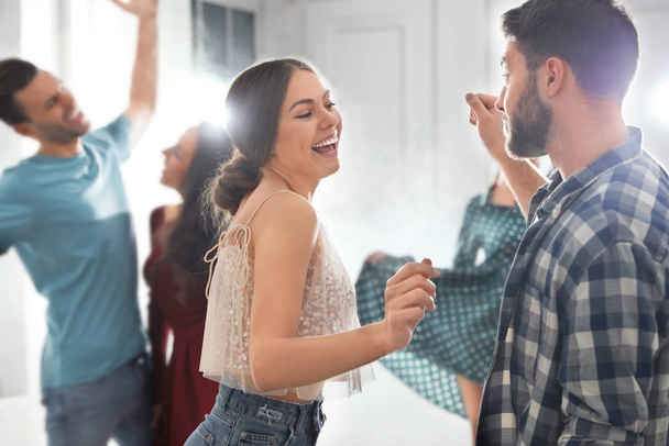 Lovely young couple dancing together at party - Photo, image