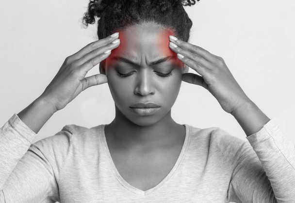 Young woman touching her head, having headache - Photo, Image