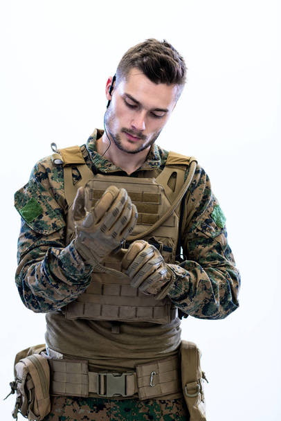 closeup of soldier hands putting protective battle gloves - 写真・画像