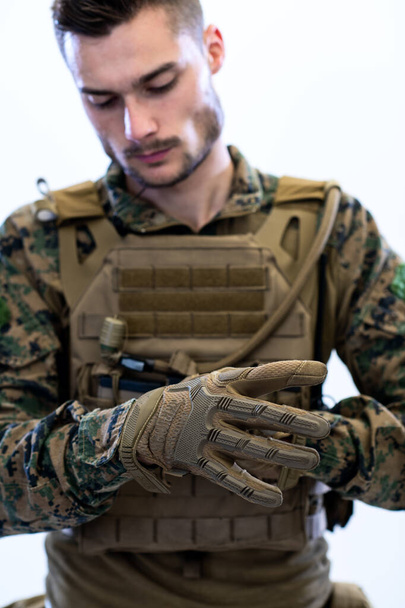 closeup of soldier hands putting protective battle gloves - Фото, зображення