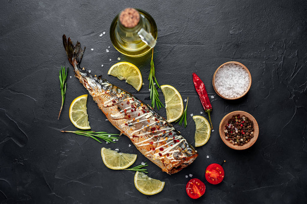 Baked mackerel with lemon, tomatoes and rosemary - Photo, Image
