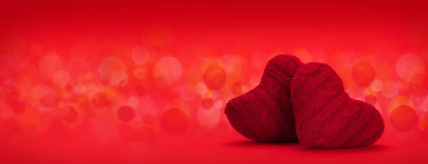 Valentines day heart decor over red background with bokeh and copy space for your greetings - Photo, Image