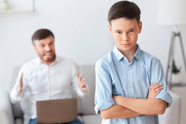 Furious Father Shouting At Son Sitting On Sofa At Home - Photo, Image
