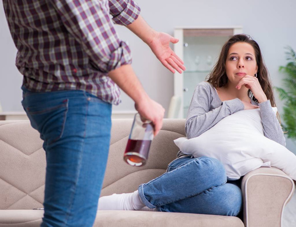 Domestic violence concept in a family argument with drunk alcoho - Photo, Image