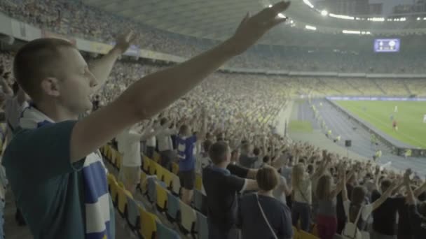 Fans in the stadium during the game. Olimpiyskiy. Kyiv. Ukraine. - Video