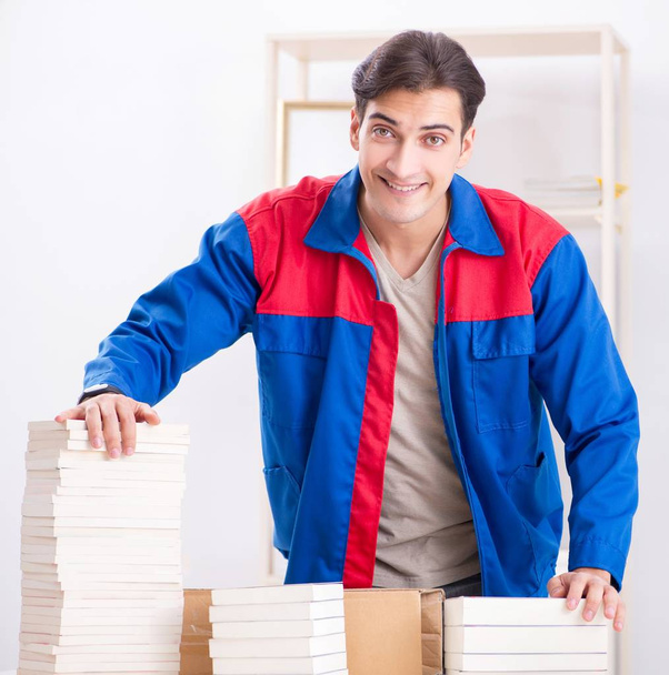 Worker in publishing house preparing book order - Photo, Image