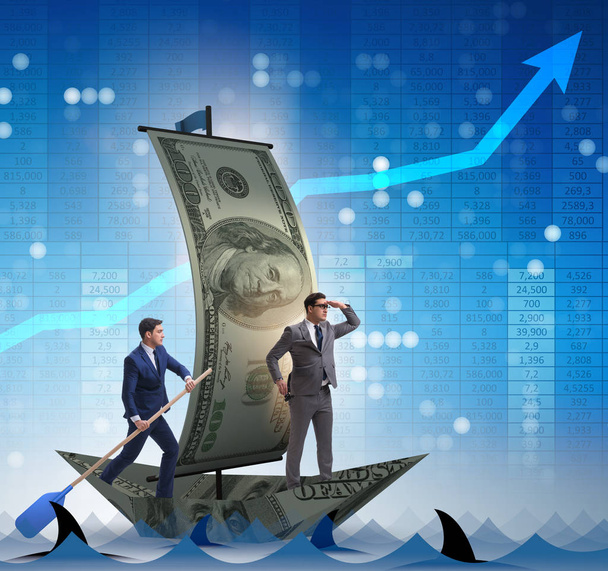 Üzletember evezés dollár hajó az üzleti pénzügyi koncepció - Fotó, kép