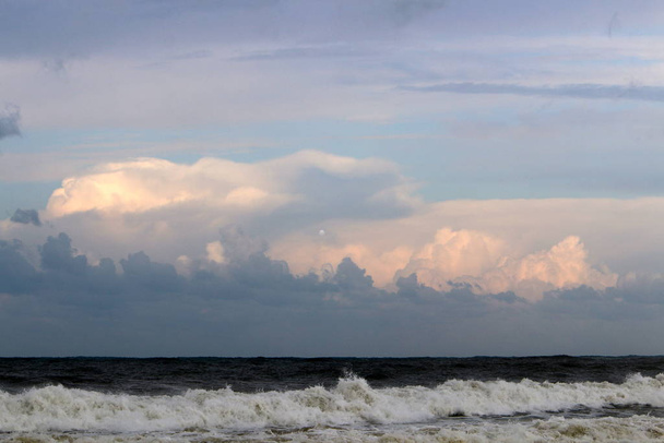 rain clouds floating in the sky over the Mediterranean Sea in the north of Israel  - Photo, Image