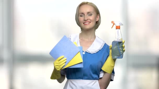 Pretty house maid holding rags and cleanser. - Footage, Video