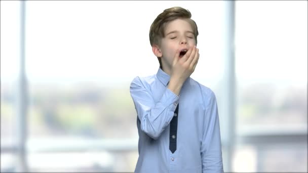 Portrait of yawning caucasian boy. - Footage, Video
