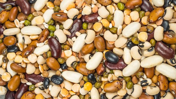 Beans of bean. Background of many grains of dried beans. Brown beans texture. Food background. - Fotografie, Obrázek