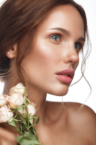 Beautiful woman with classic nude make-up, light hairstyle and flowers. Beauty face. - Foto, Bild