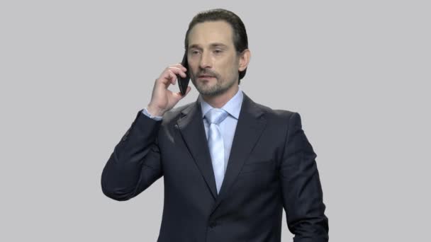Confident businessman talking on cell phone. - Footage, Video