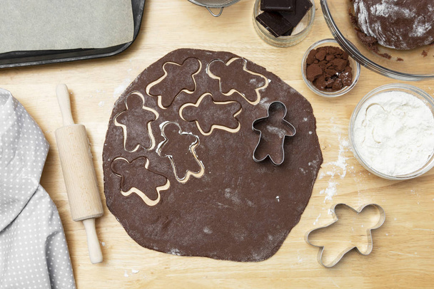 Top view of cooking process, festive Christmas gingerbread chocolate cookies. Cooking chocolate cookies or dessert. - Valokuva, kuva