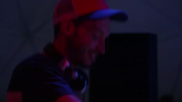 DJ plays music at the party. Disco. Festival. Joy. - Felvétel, videó