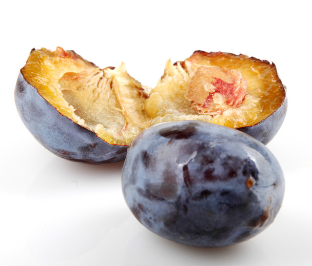 Plums On A White Background - 写真・画像