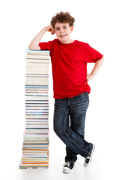 Student near the pile of books - Foto, afbeelding