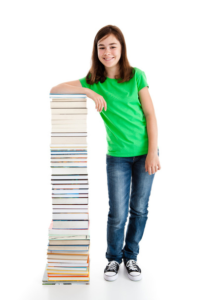 Student standing near the books - Foto, afbeelding