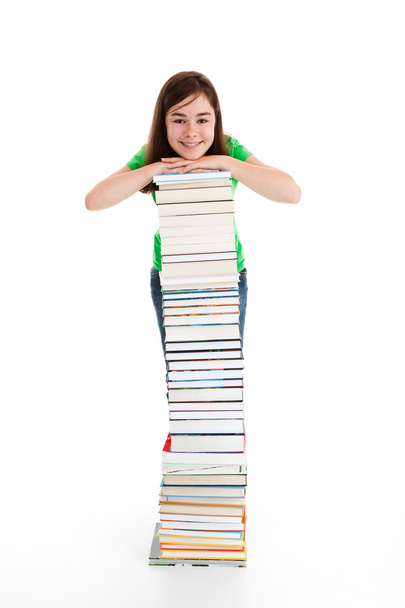 Student standing near the books - Foto, Imagen
