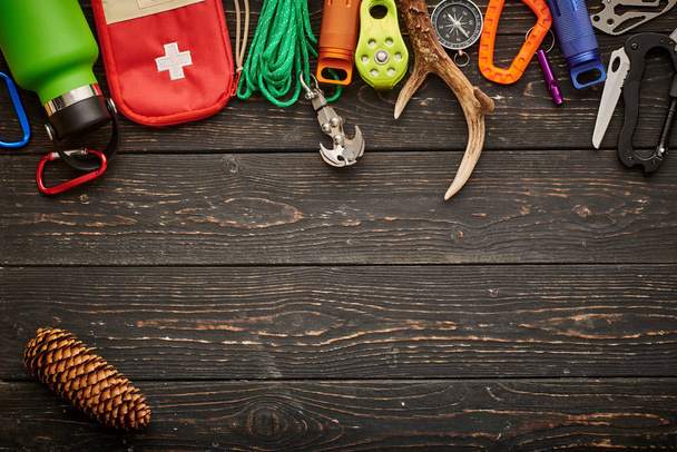 Travel items for hiking over wooden background - Foto, imagen