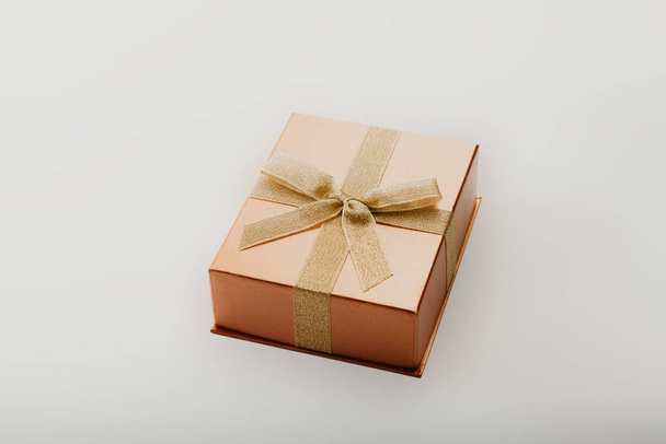 Gift box with bow on white background - Valokuva, kuva