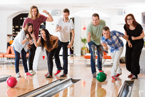 Young Friends Bowling While People Cheering - Photo, Image