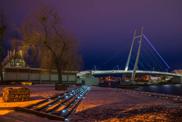 Bridge over the lake in Mikolajki at night, Masuria, Poland - Photo, Image