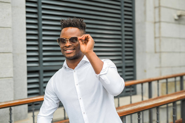 handsome young african man in a white shirt - Foto, Bild