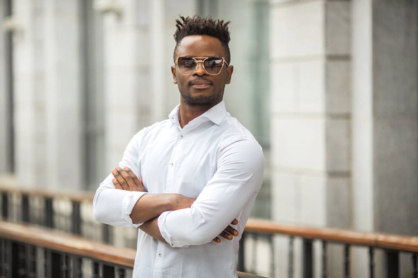 handsome young african man in a white shirt - Fotó, kép