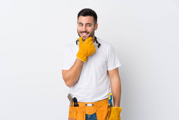 Craftsmen or electrician man over isolated white background thinking an idea - Photo, Image