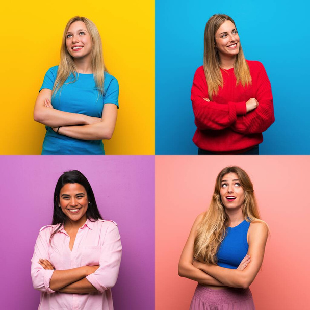 Set of women over isolated backgrounds looking up while smiling - Photo, Image