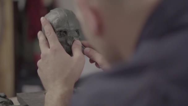 Man male sculptor is working on the creation of sculpture. Kyiv. Ukraine. - Metraje, vídeo