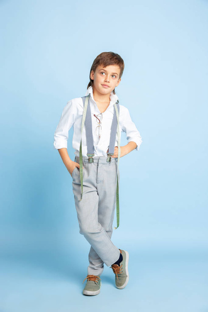 Little boy dreaming about future profession of seamstress - Valokuva, kuva