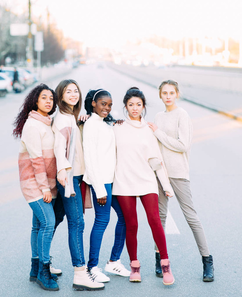 Multiracial group of friends stands on city street. - Photo, Image