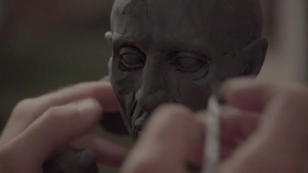 Man male sculptor is working on the creation of sculpture. Kyiv. Ukraine. - Filmagem, Vídeo